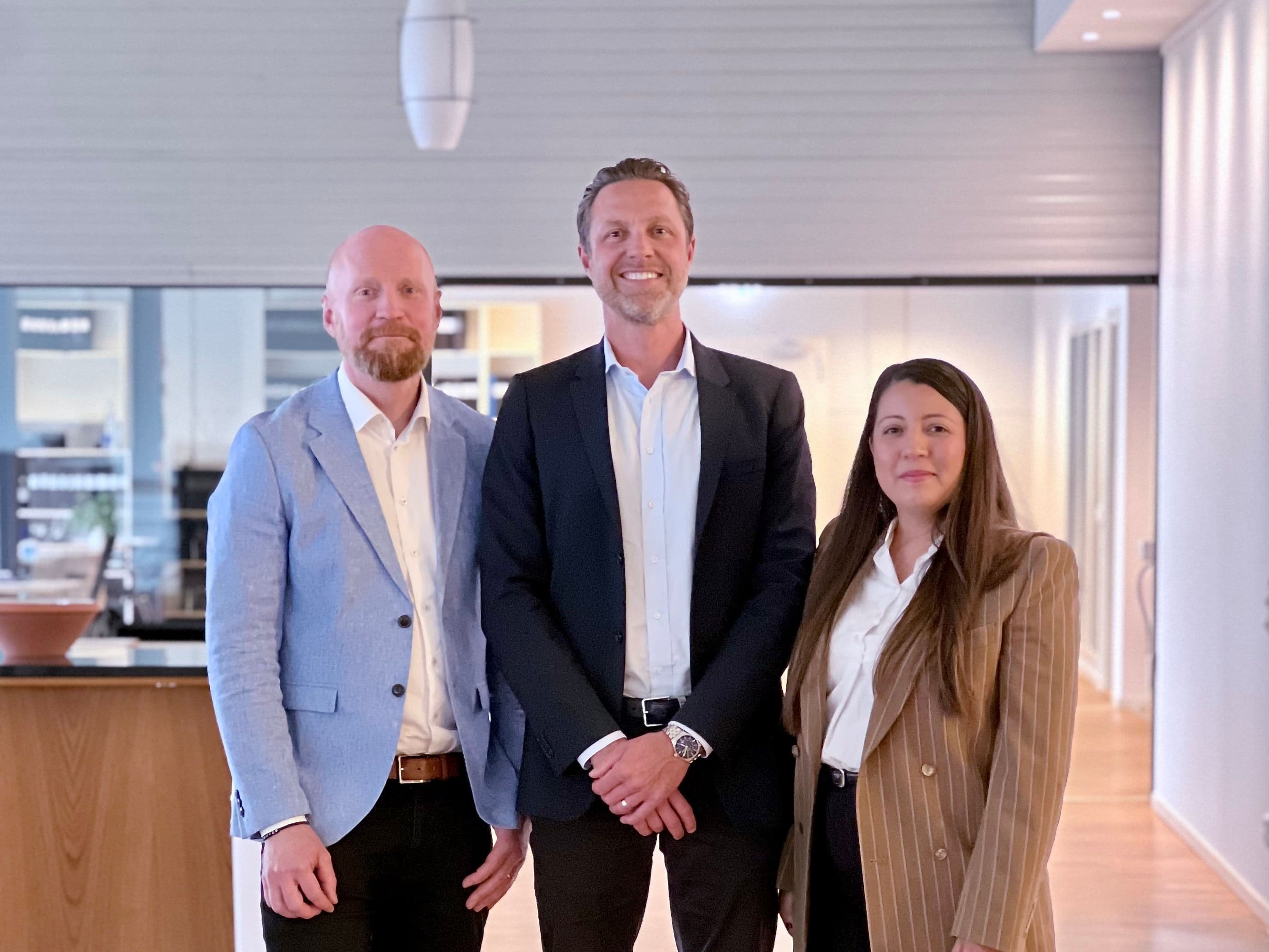 Group photo of DREV leadership team: CTO Thomas Tingelöf, CEO Arelys Sosa, and Chairman Alexander Petrofski.