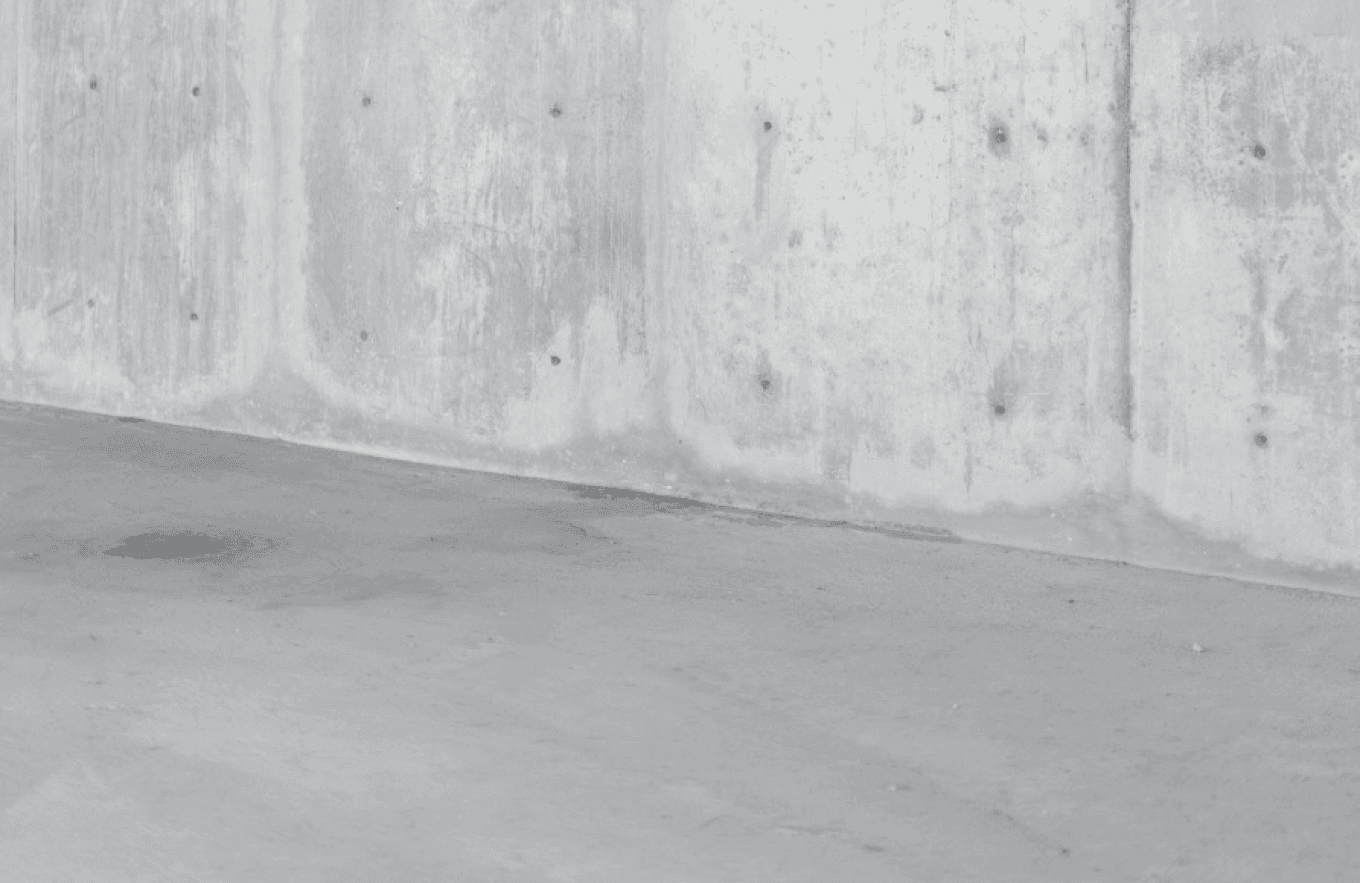 Grey backdrop of wall and ground made out of grey stone like material