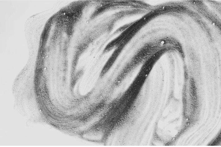 black transparent swirly liquid on white backdrop